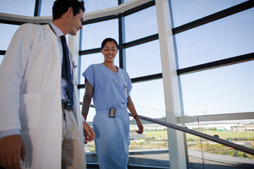 Doctor and nurse talking on staircase