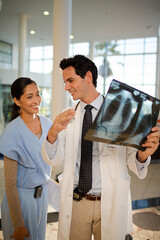 Doctor and nurse viewing chest x-rays