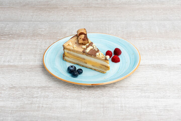 Portion of delicious kinder-flavored cake with berries and raspberries