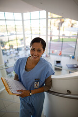 Portrait of smiling nurse on hospital staircase