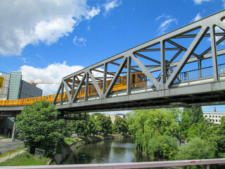 Berlin Germany Metro Train Crossing an Iron Truss Bridge over a River