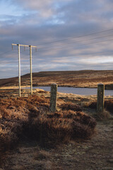 Sunrise Welsh landscape with telegraph pole