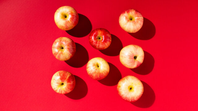 Large fresh red apple on red background gala schnico brookfield mema devil must