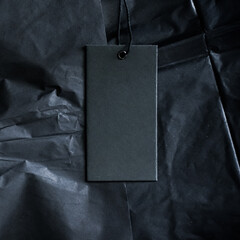 Black luxe clothing tag, sustainable fashion and brand label concept.
