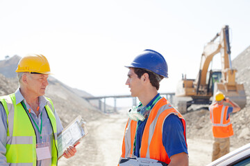 Business people talking in quarry