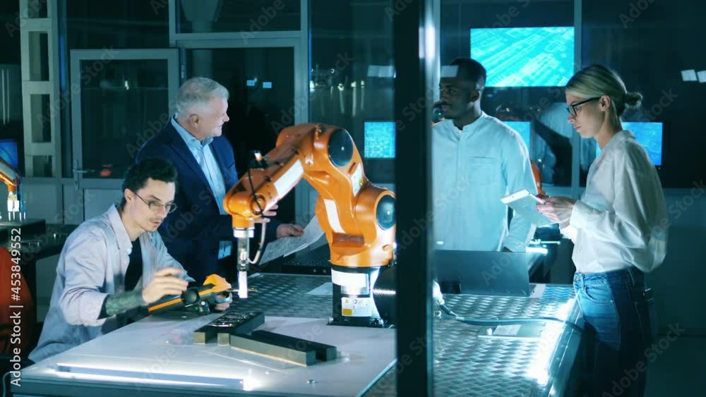 Wall mural robotics laboratory with it engineers doing a research