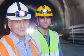 Workers reading blueprints on site
