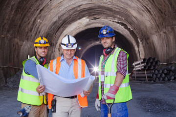 Business people and workers standing in quarry