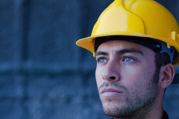 Worker holding sledgehammer in tunnel