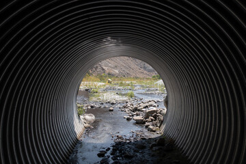 A Highway Culvert Bypass for a River under a Road - obrazy, fototapety, plakaty