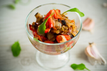 fried eggplants with peppers, tomatoes, onions and garlic