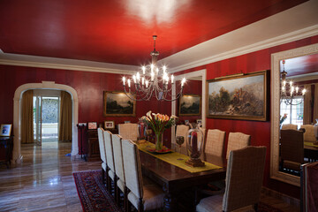 Chandelier over dining table in luxury dining room