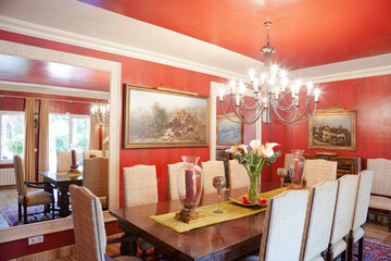Chandelier over dining table in luxury dining room