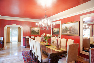 Chandelier over dining table in luxury dining room