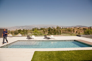 Swimming pool overlooking tree and mountains