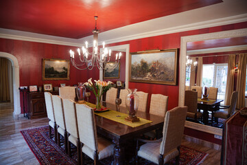 Chandelier over dining table in luxury dining room