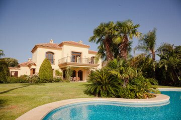 Luxury swimming pool and Spanish villa