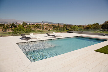 Swimming pool overlooking tree and mountains