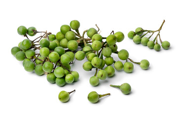 Heap of green Thai eggplants close up isolated on white background  