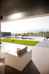 Luxury patio overlooking swimming pool and mountains