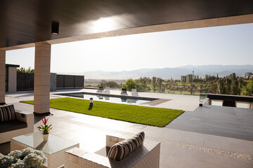 Luxury patio overlooking swimming pool and mountains