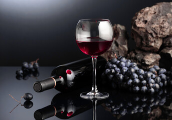 Blue grapes and red wine.