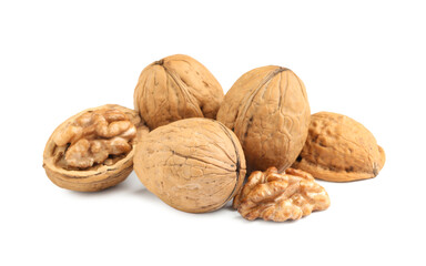 Pile of ripe walnuts on white background