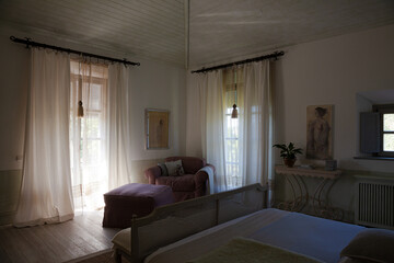 Sun shining through window into luxury bedroom
