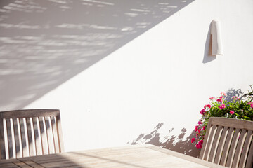 Wooden table and chair in sunlight