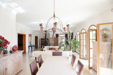 Chandelier over dining table in luxury dining room
