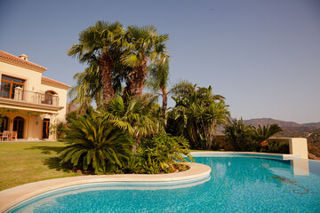 Luxury swimming pool and Spanish villa