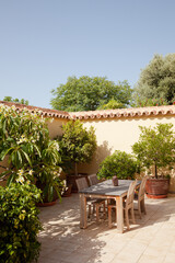 Wooden table and chair in sunlight