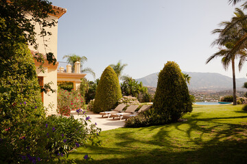 Lounge chairs and towels outside luxury hotel