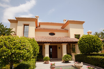 Potted plants in formal garden outside villa