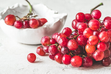 Fresh ripe red grapes on white background