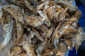 Fried fish with a natural background. Indonesian fried fish covered with flour, usually use small fish. This food also called wader goreng