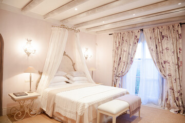 Bed with canopy in luxury bedroom