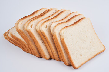 Square slices of toast sandwich bread isolated on white background close up