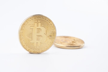 Heap of golden bitcoins isolated on white background close up with copy space