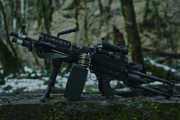 Loaded airsoft weapon close-up in the forest