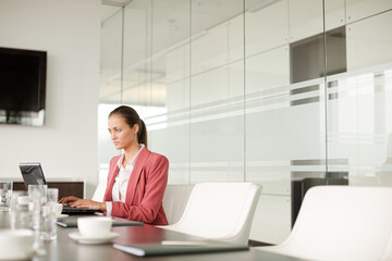 Businesswoman working at computer at desk