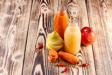 Fresh juices from pears, apples ,carrots, rosehip fruits. Healthy food, vitamins from nature