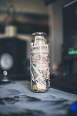 a bottle filled with money