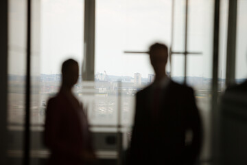 Business people talking in office hallway