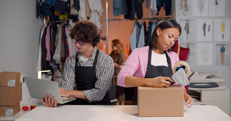 Online store merchants working at store preparing products to deliver to customers