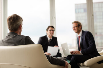 Fototapeta premium Businessmen sitting in meeting