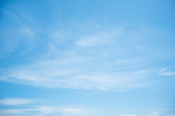 Beautiful white cloud with blue sky background.Bright blue sky background with tiny clouds.