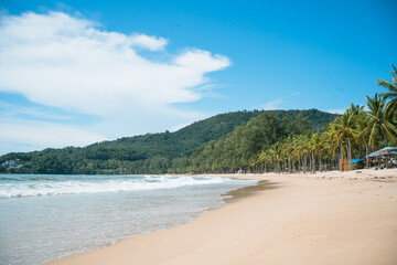 waves nature splashes sand beach on sunlight.blue sea and sky famous beach.