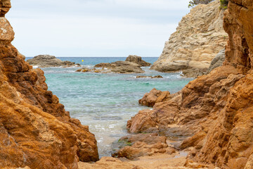 beach and rocks with calm sea
