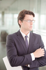 Businessman sitting on sofa in office lobby